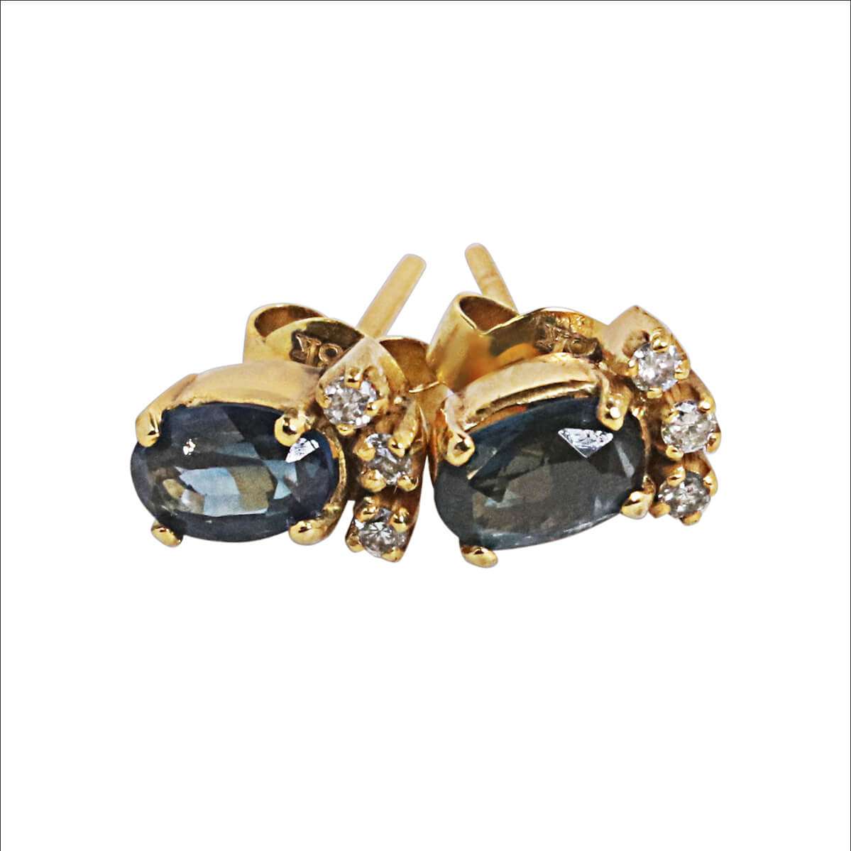 Crown studs set in 18k with diamond and a large sapphire 0.89ct